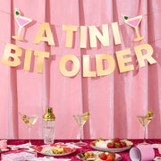 Tini Bit Older Banner - gold foil banner