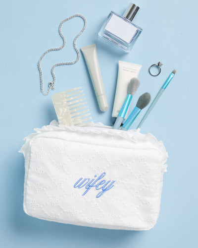 White eyelet cotton Wifey cosmetic bag with blue embroidery